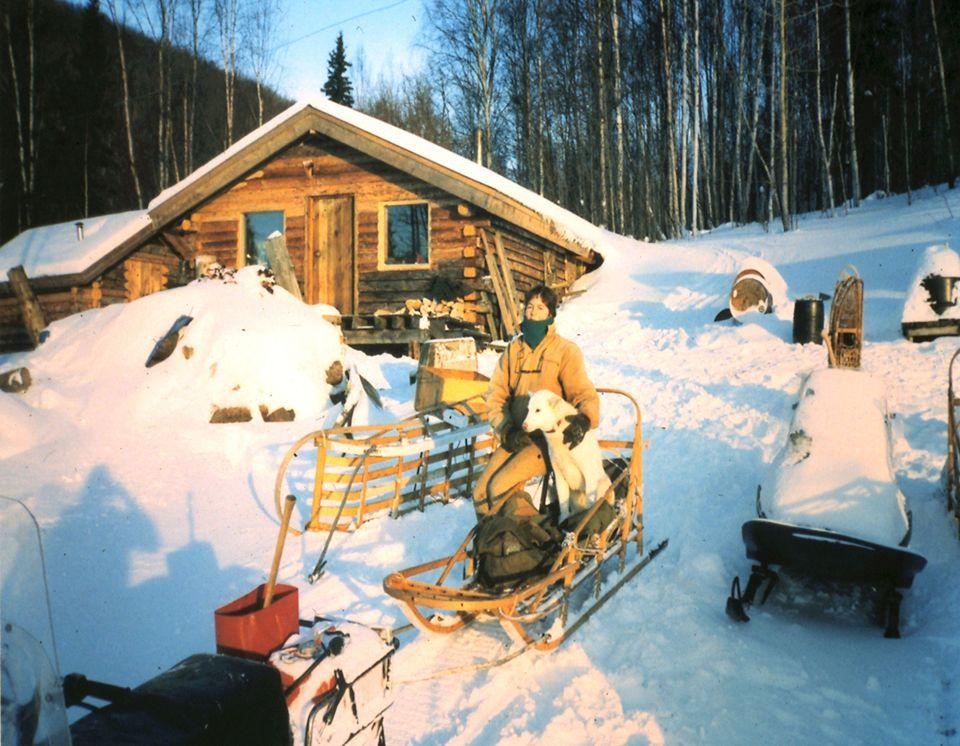 Linda with her dog Gwen, her best friend in the quiet and lonely wilderness.